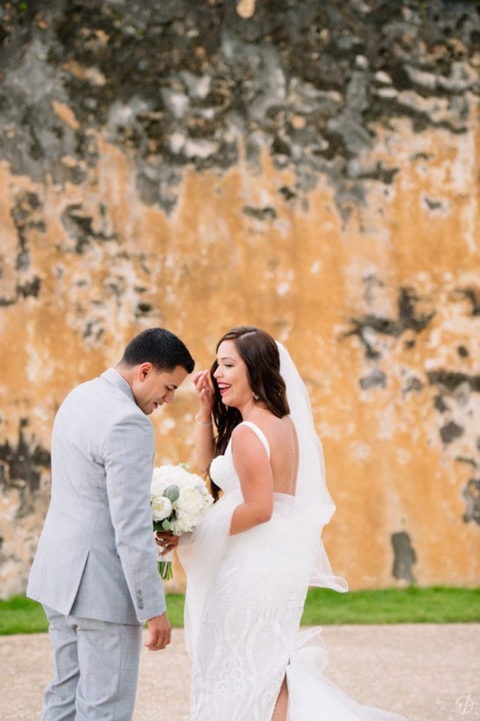 First look session and wedding portraits at Castillo San Cristobal by Puerto Rico wedding photographer