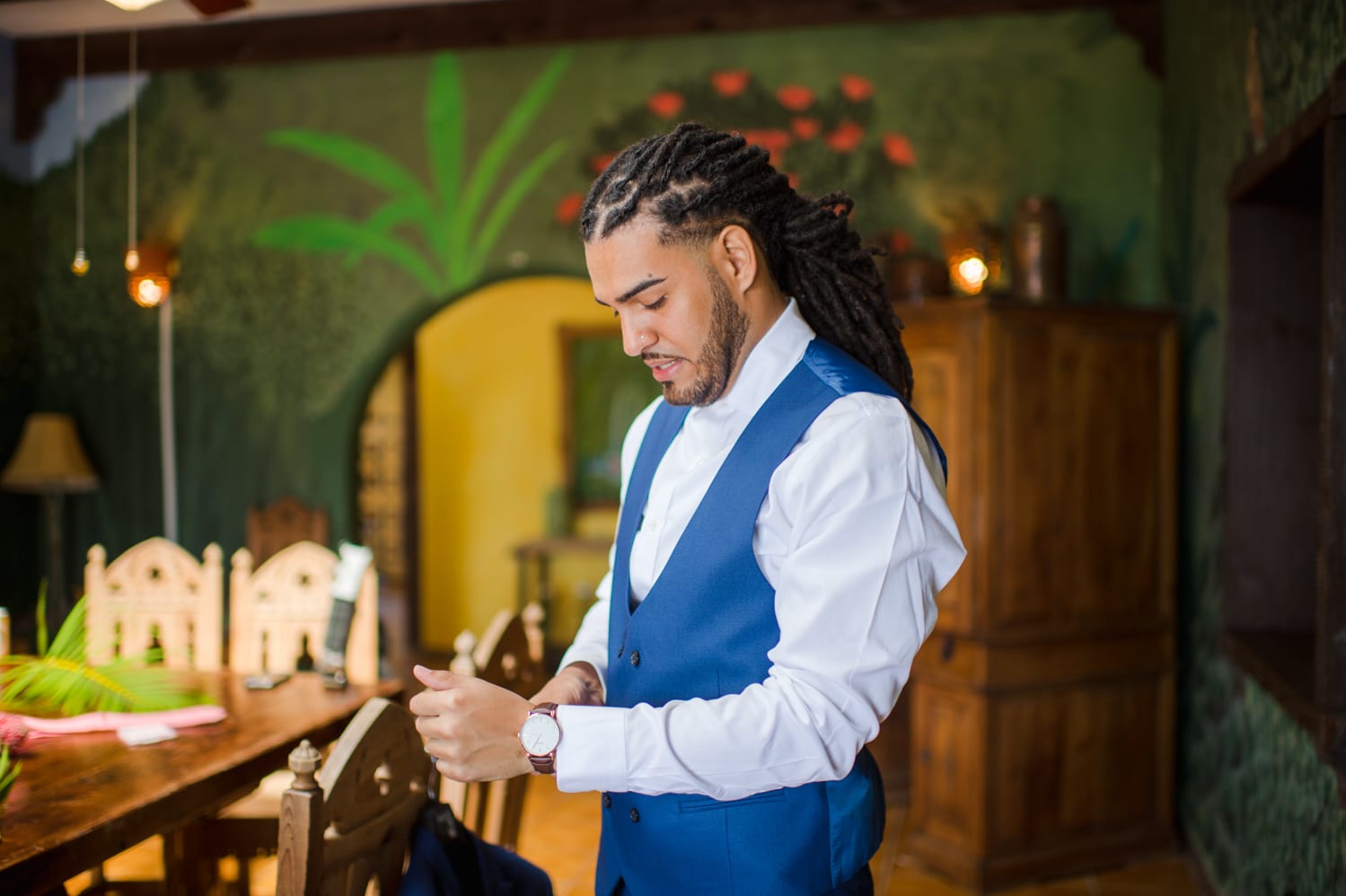 groom getting ready for his wedding at Villa Loma Sol airbnb by photographer Camille Fontanez