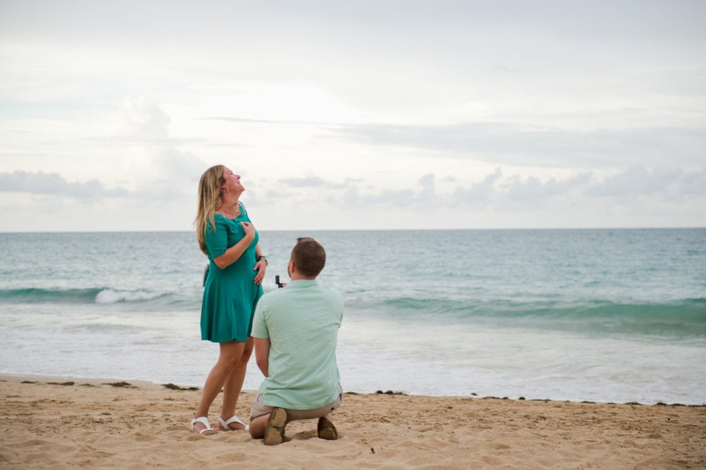 surprise proposal photos at Condado Beach by Puerto Rico wedding photographer Camille Fontanez