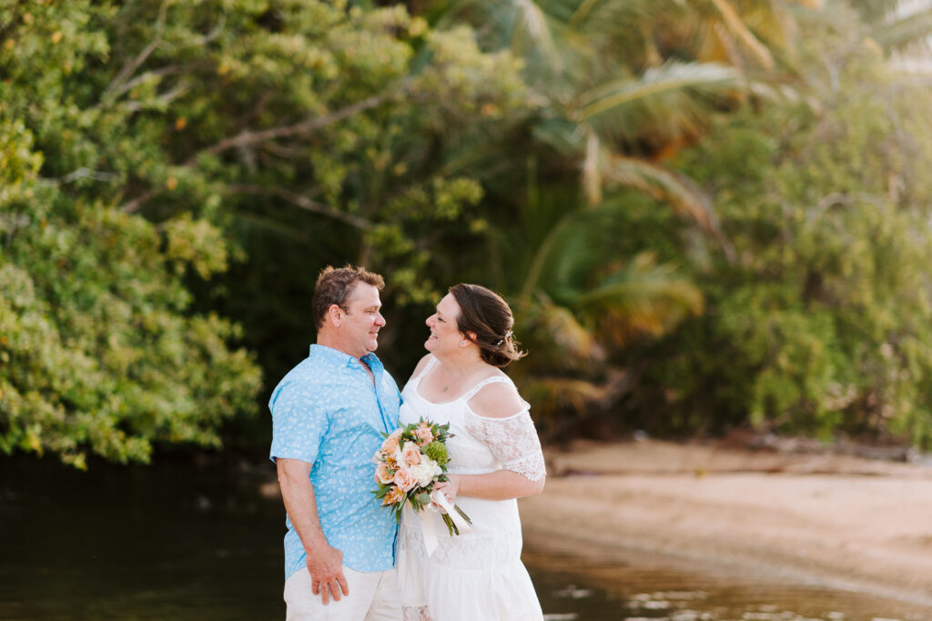 Jessica and Chad's stunning and simple sunset elopement photography at Luquillo Beach in Puerto Rico. Wedding photography by Camille Fontz.