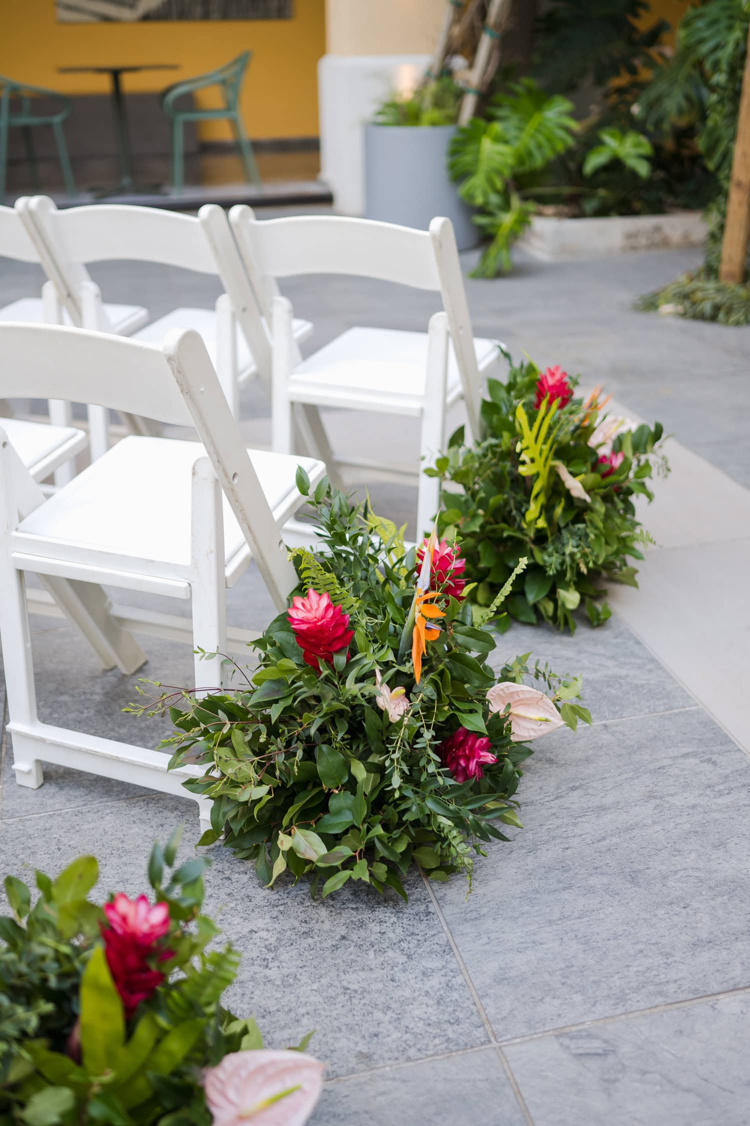 Wedding guests relaxing in the courtyard of a historic venue during an intimate destination wedding in Old San Juan.