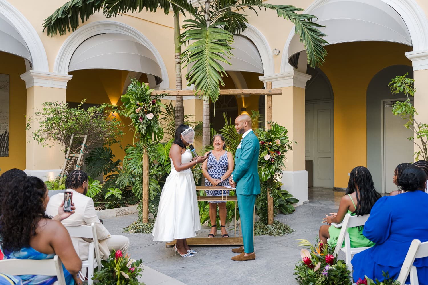 Couple exchanging vows during an intimate destination wedding ceremony at Hotel Palacio Provincial in Old San Juan.