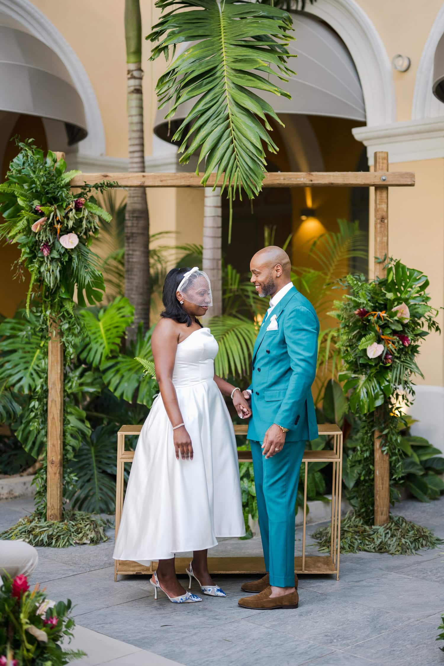 Couple exchanging vows during an intimate destination wedding ceremony at Hotel Palacio Provincial in Old San Juan.