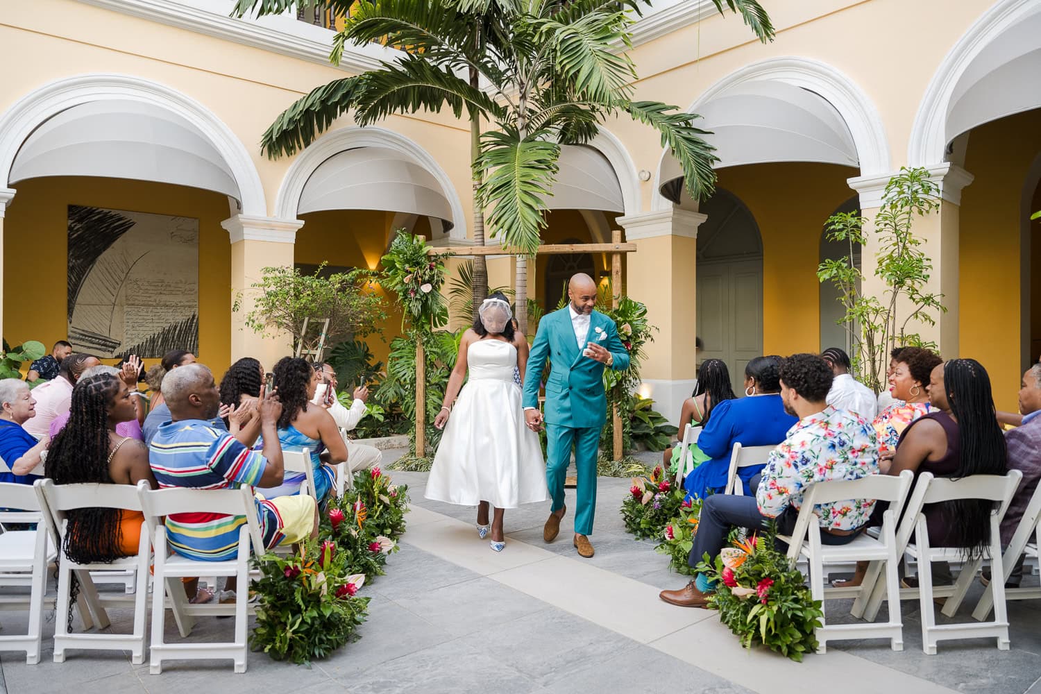 Couple exchanging vows during an intimate destination wedding ceremony at Hotel Palacio Provincial in Old San Juan.