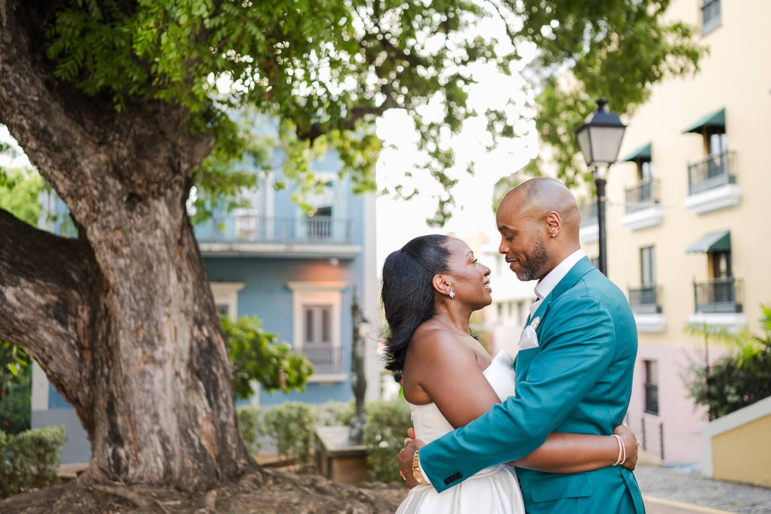 Couple walking through the colorful streets of Old San Juan during their intimate destination wedding photoshoot.