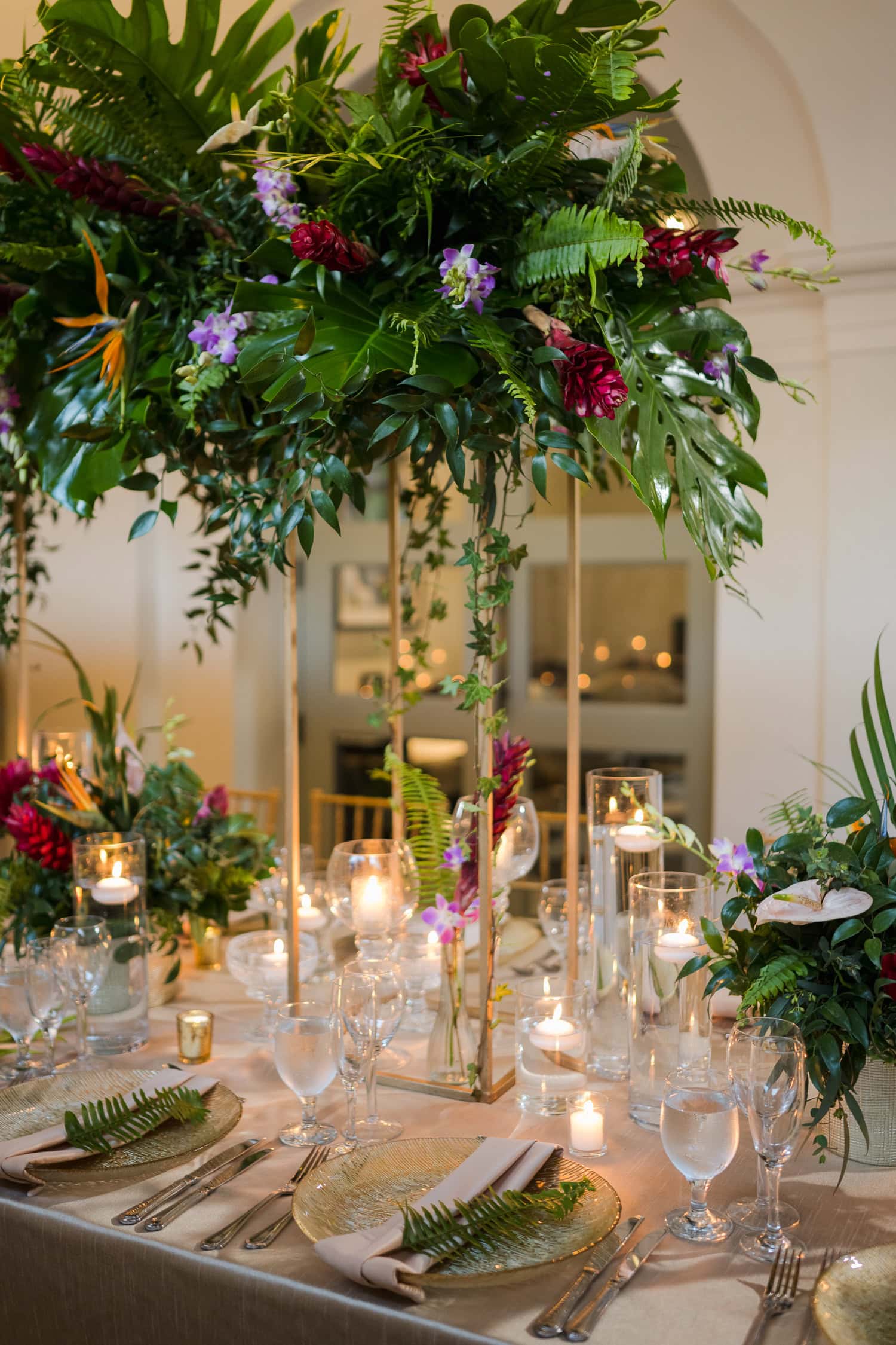 Beautifully decorated reception table with candles and lush floral arrangements at an intimate destination wedding in Old San Juan.