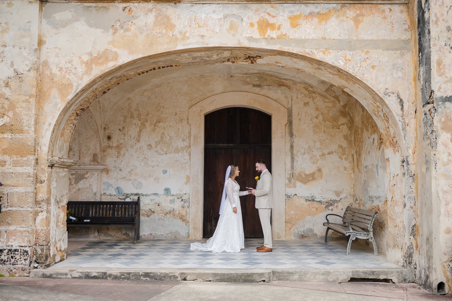 private vows before intimate wedding ceremony at castillo san cristobal puerto rico