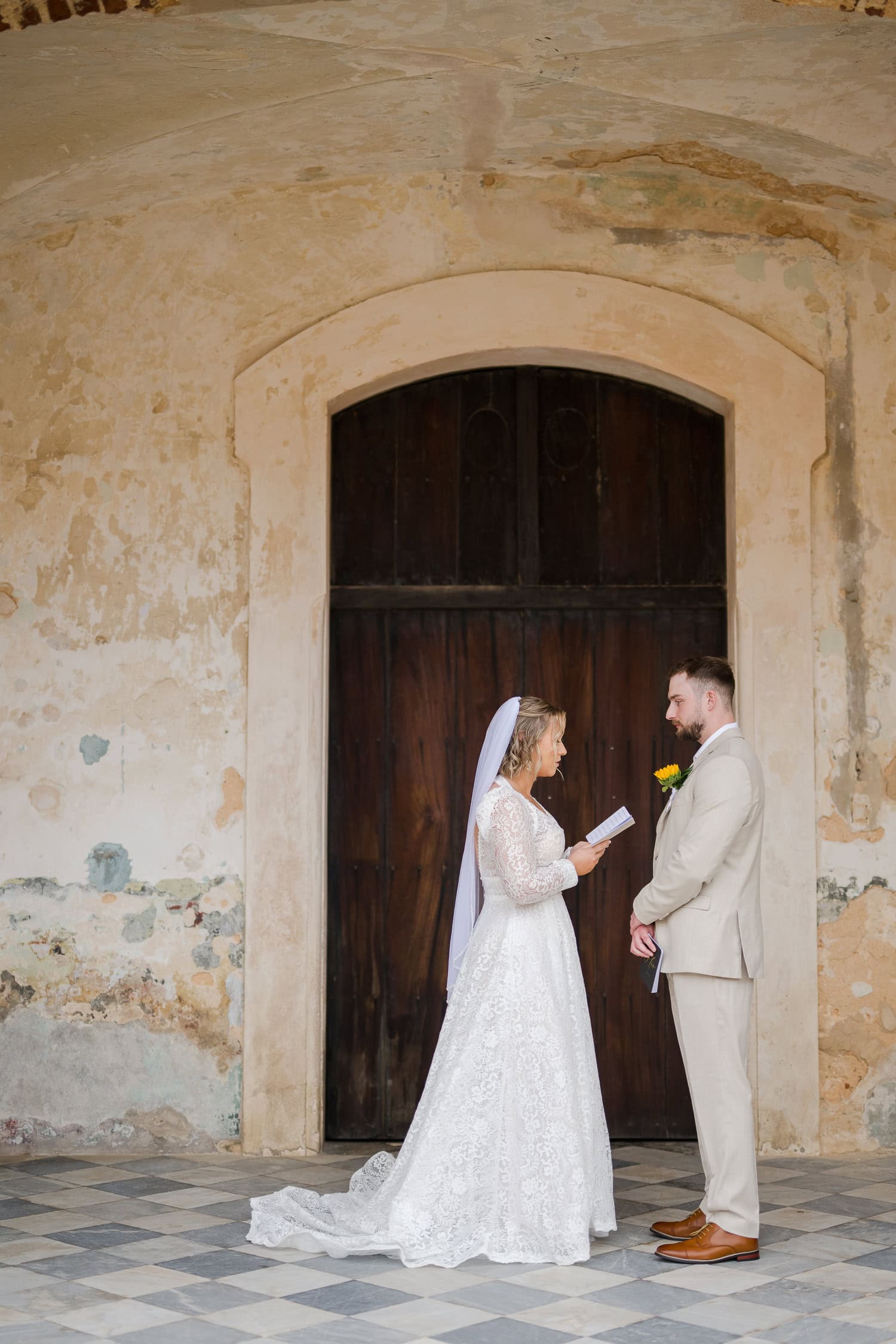 private vows before intimate wedding ceremony at castillo san cristobal puerto rico