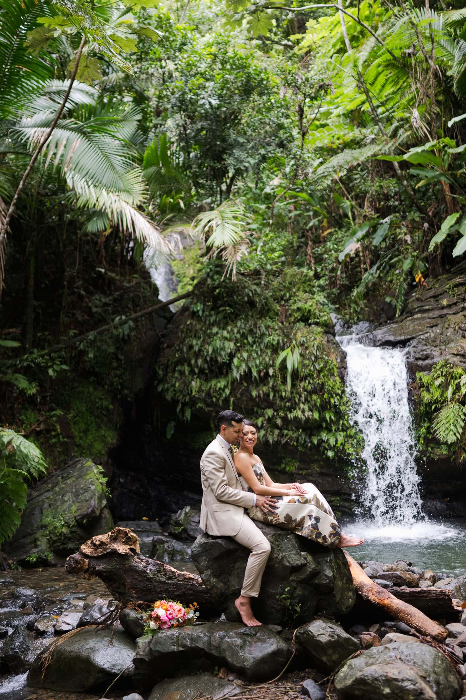 Couple exchanging vows at Juan Diego Falls, El Yunque National Forest