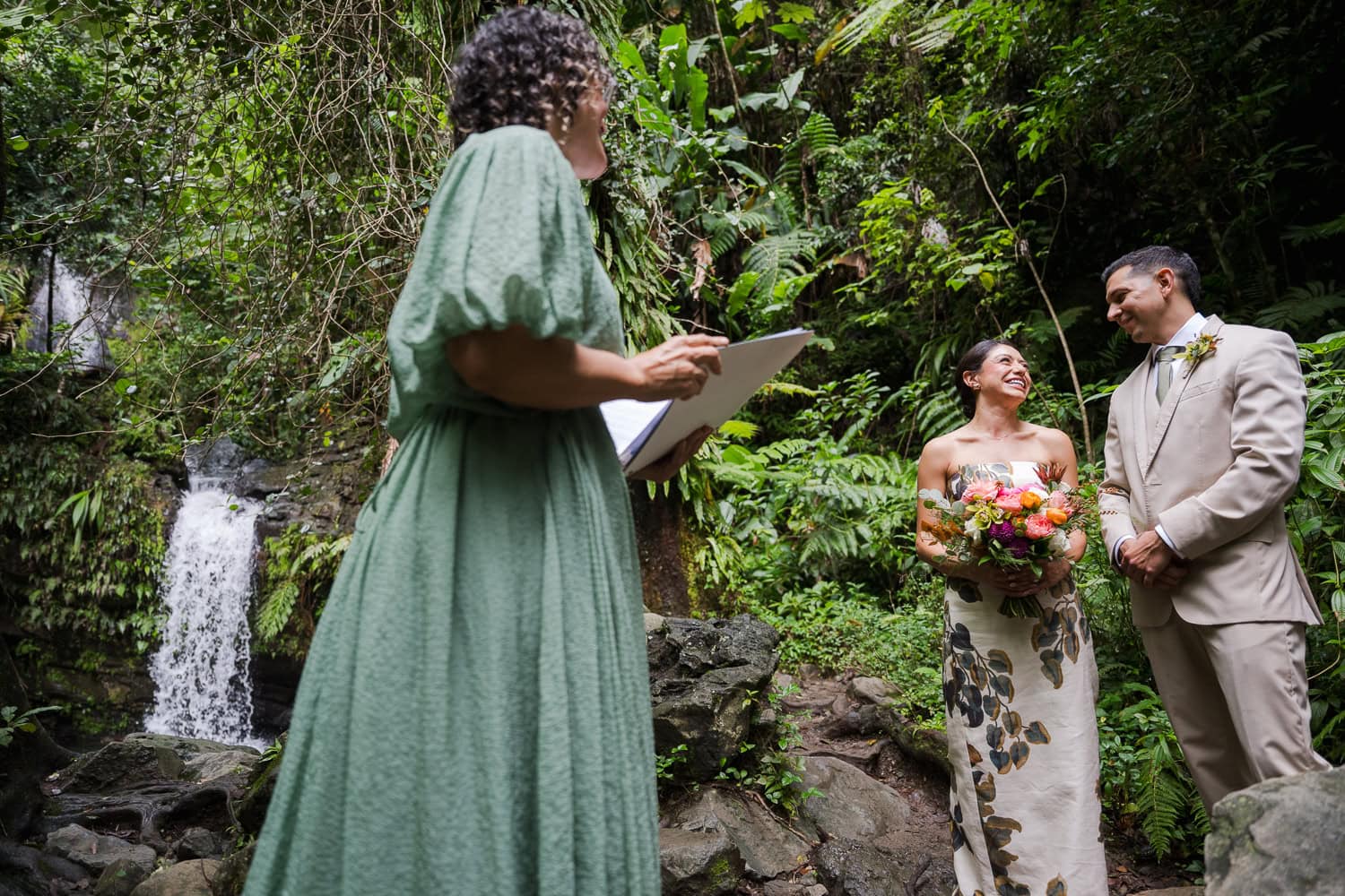 Couple exchanging vows at Juan Diego Falls, El Yunque National Forest