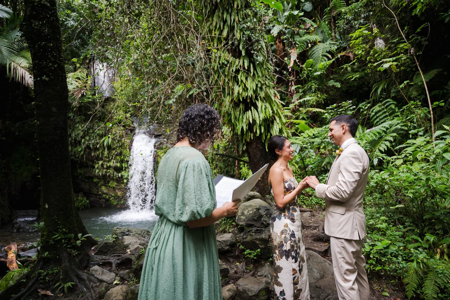 Couple exchanging vows at Juan Diego Falls, El Yunque National Forest