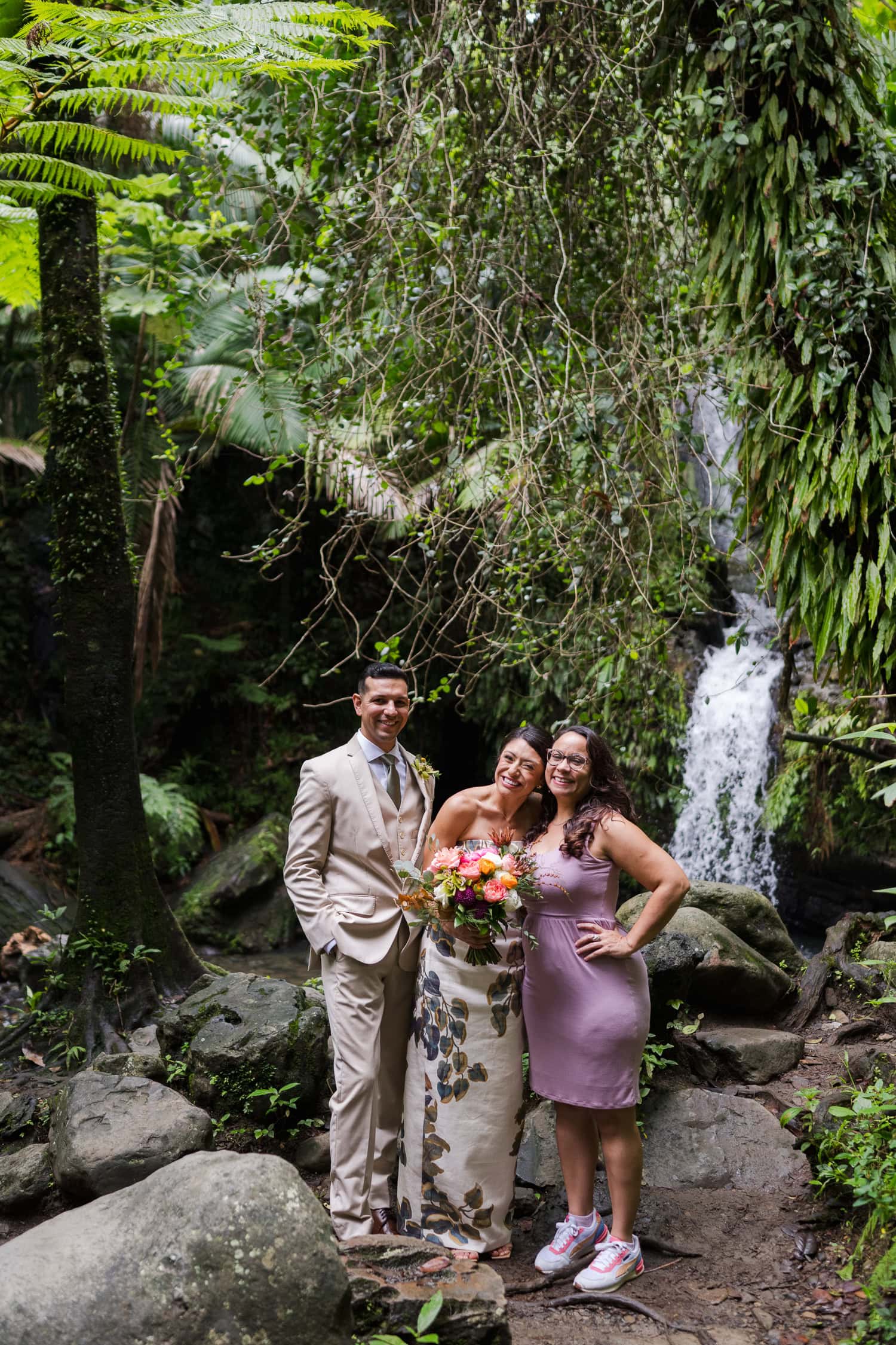 Couple exchanging vows at Juan Diego Falls, El Yunque National Forest