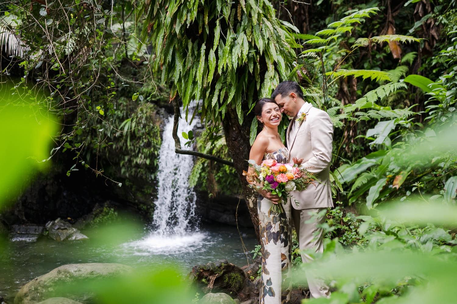 Couple exchanging vows at Juan Diego Falls, El Yunque National Forest