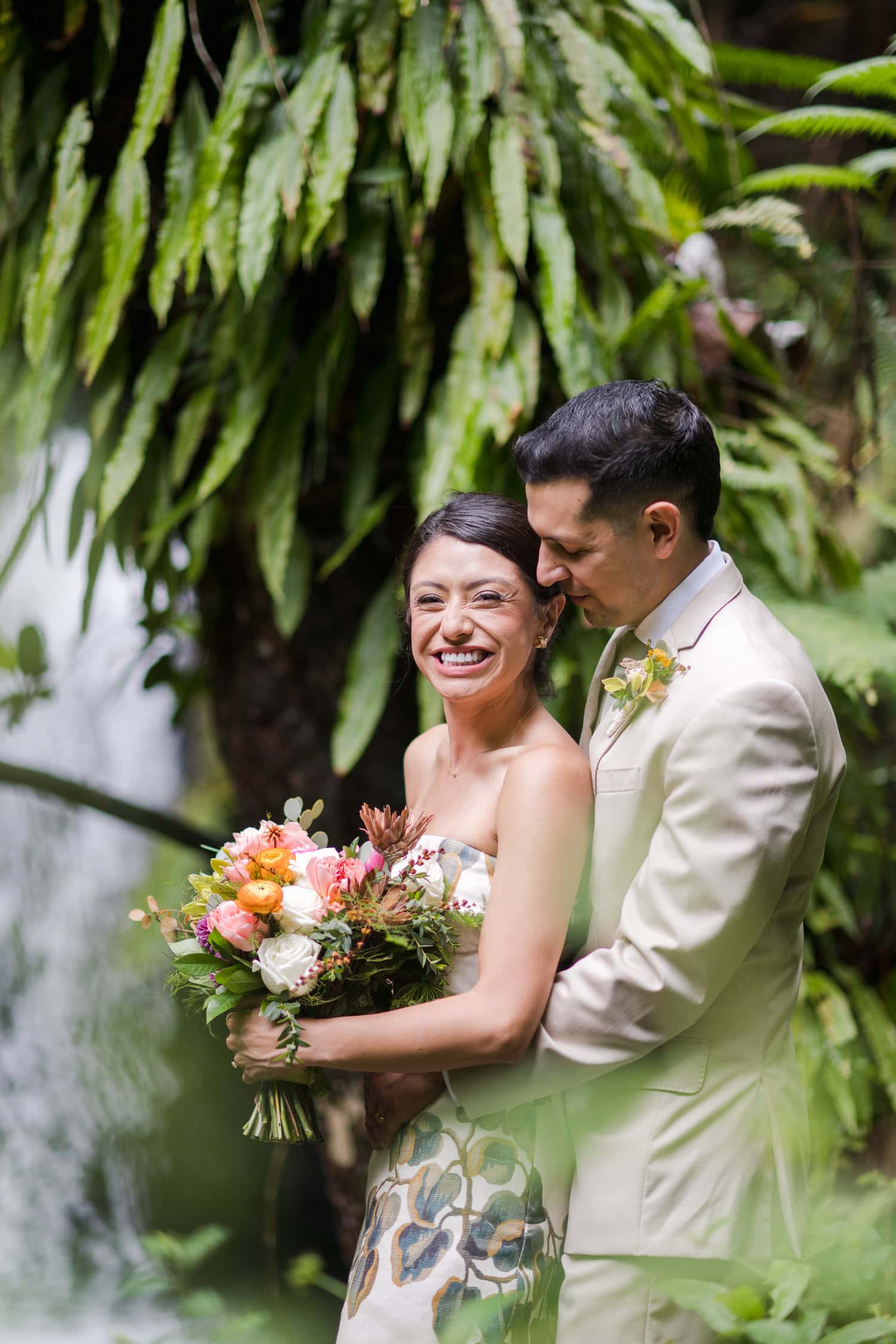 Couple exchanging vows at Juan Diego Falls, El Yunque National Forest