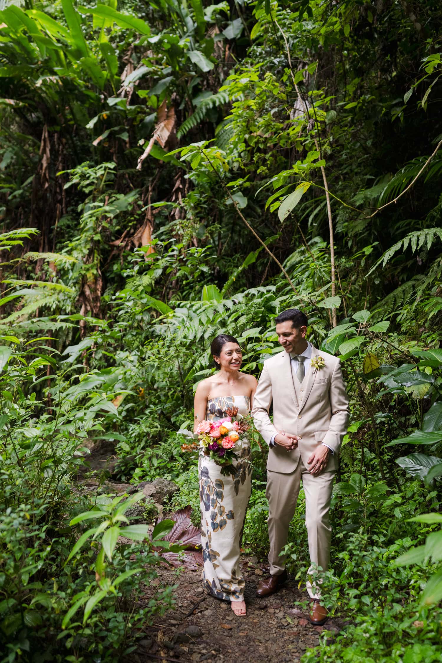 Couple exchanging vows at Juan Diego Falls, El Yunque National Forest