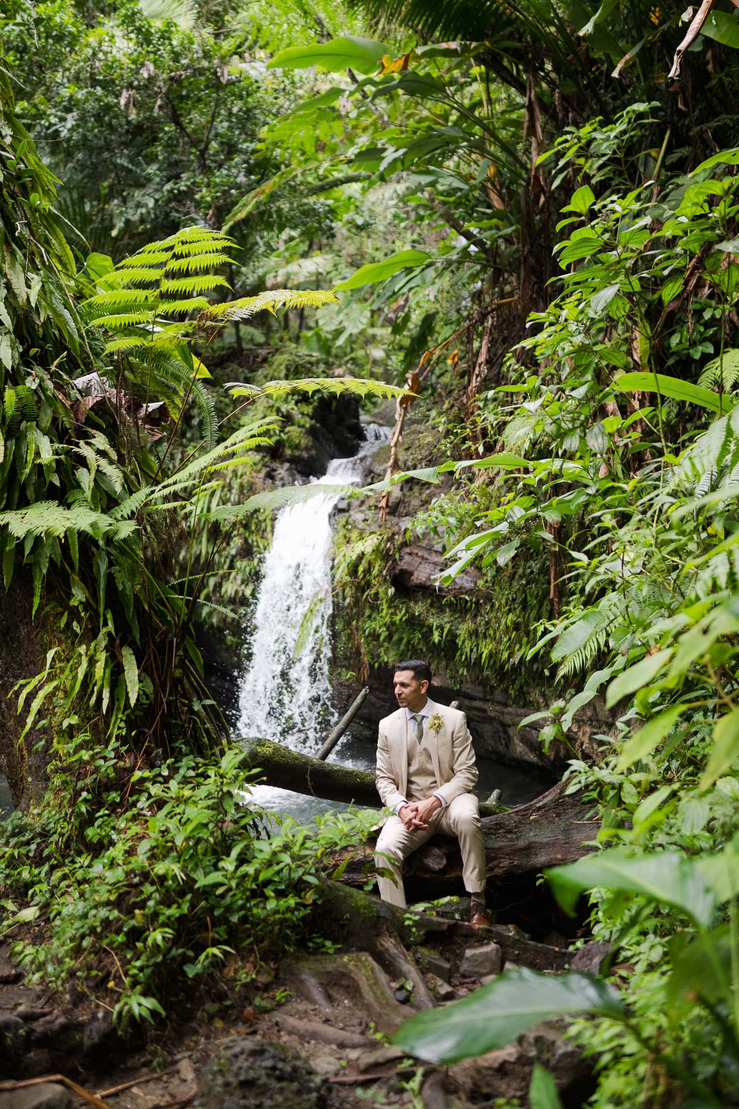 Couple exchanging vows at Juan Diego Falls, El Yunque National Forest