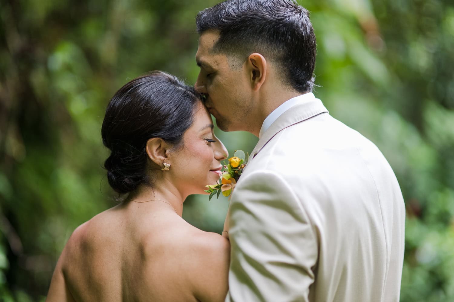 Couple exchanging vows at Juan Diego Falls, El Yunque National Forest