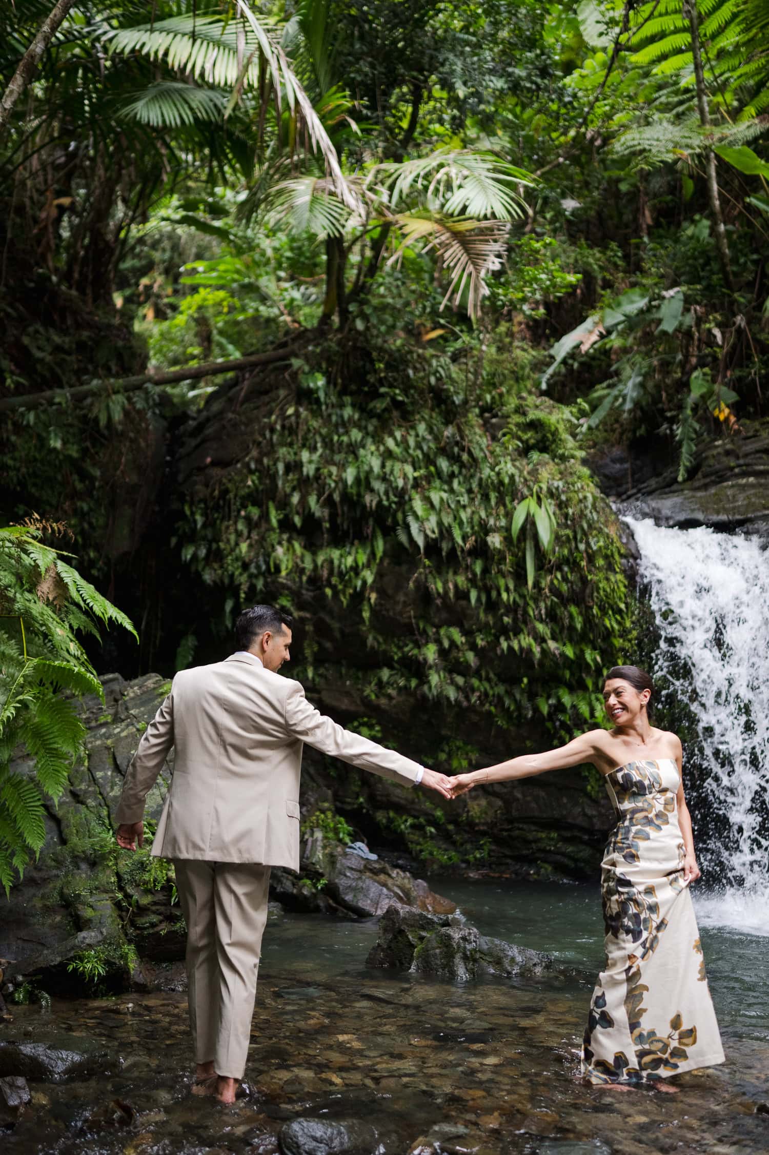 Couple exchanging vows at Juan Diego Falls, El Yunque National Forest