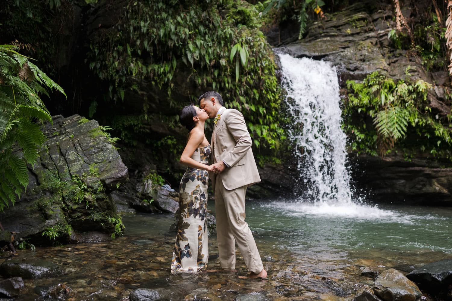 Couple exchanging vows at Juan Diego Falls, El Yunque National Forest