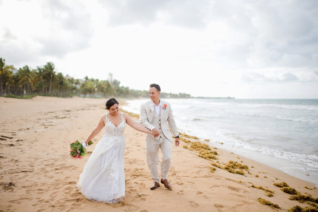 Newlywed portraits by palms at Rio Grande beach