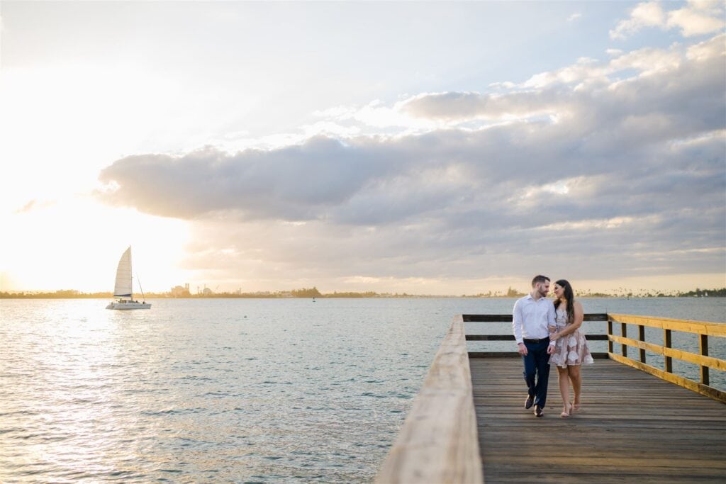 Engagement session photography in Old San Juan, Puerto Rico by sunset with sailboats in the background