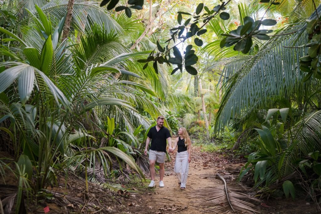 Newly engaged portraits at the Wyndham Grand Rio Mar in Rio Grande, Puerto Rico. A wild, windy Valentine's Day session through jungle trails, the resort beach, and golden hour on the golf course lawn.