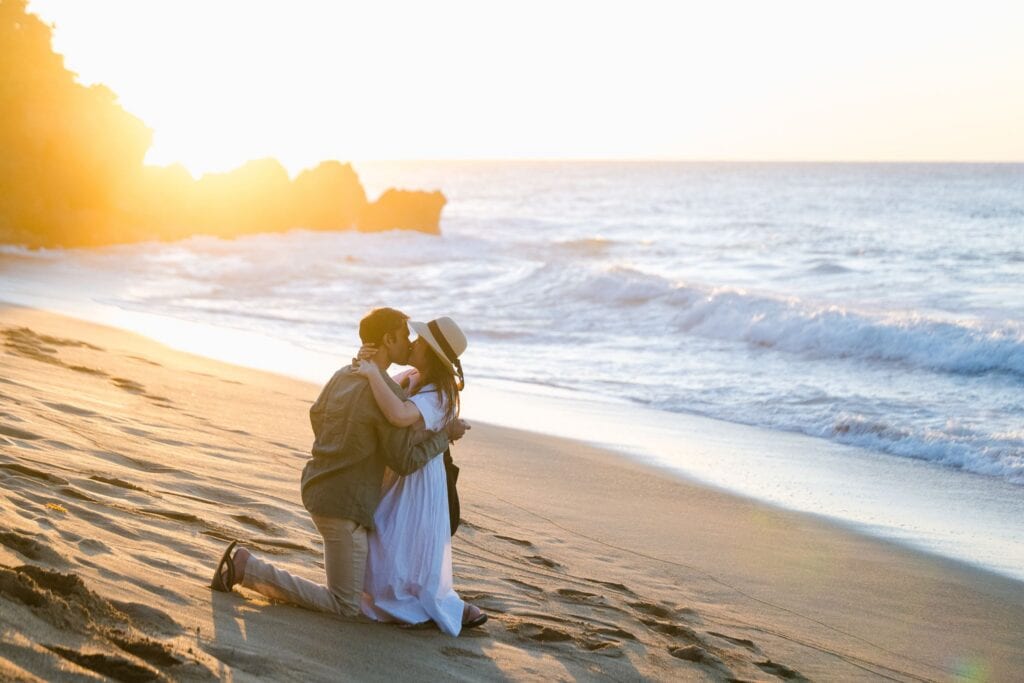 A sunset surprise proposal at Domes Beach in Rincon, Puerto Rico, with golden light, raging surf, and a California couple's happy ending near Punta Higuero.